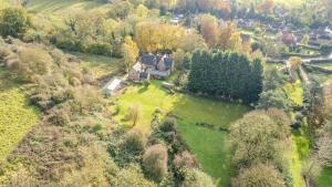 an aerial view of a large house in a field at Country House with 7 bedrooms and 3 buildings in Market Rasen