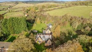 an aerial view of a large house in a field at Country House with 7 bedrooms and 3 buildings in Market Rasen +99 photos