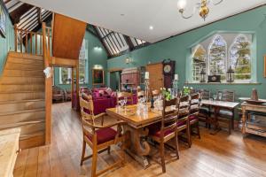 a dining room with a table and chairs at Country House with 7 bedrooms and 3 buildings in Market Rasen