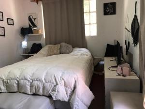 A bed or beds in a room at Mi Bella Vista - Quinta Con Pileta