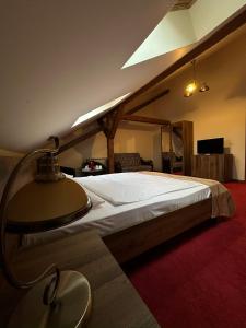 a bedroom with a large bed in a room at Antique ApartHotel in Alba Iulia