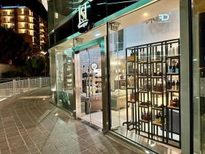 a store window with a lot of bottles of wine at Stunning 2BR APT w/Pool&Garden in St Julian's