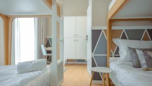 Postel nebo postele na pokoji v ubytování Pedra de Sal - Hostel & Suites