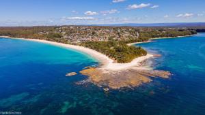 an aerial view of an island in the ocean at Ocean Breeze Vincentia by Book Jervis Bay in Vincentia +15 photos