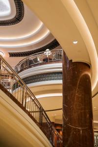 a spiral staircase in a building with a pillar at Park Hyatt Melbourne in Melbourne