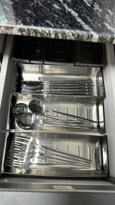 three empty drawers in an oven at Luxury 2 bedroom new brand in Ajman 