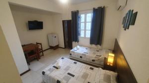 Postel nebo postele na pokoji v ubytování Hotel Viola