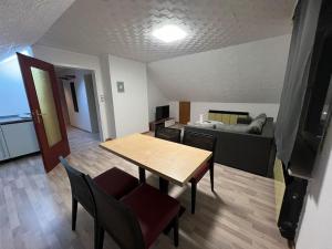 a room with a table and chairs and a bed at Wohnung in Herford in Herford