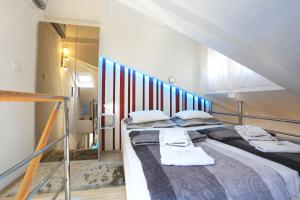 Ένα ή περισσότερα κρεβάτια σε δωμάτιο στο Apartments Ella