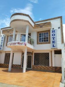 a large white building with a balcony on it at Hotel Orquídea Real in Valledupar