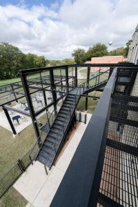 a staircase on top of a building next to a field at Western 1924 Luxury Lofts in Martindale