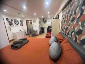 a bedroom with a large bed with pillows on it at Nice StudioFLAT in London in London
