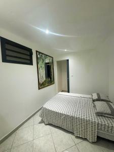Postel nebo postele na pokoji v ubytování Au Moulin Paradisiaque