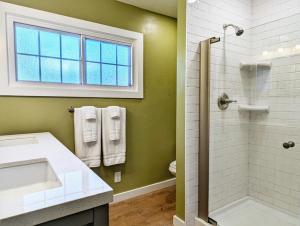 a bathroom with a sink and a shower at The Garden House of Downtown Manitou Springs in Manitou Springs
