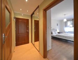 Łóżko lub łóżka w pokoju w obiekcie Villa Avangarda