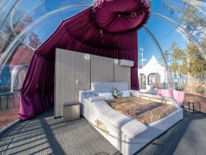 Ein Bett oder Betten in einem Zimmer der Unterkunft Fuji Hoshizorano Mura Tabist
