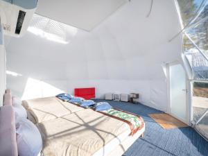 Ein Bett oder Betten in einem Zimmer der Unterkunft Fuji Hoshizorano Mura Tabist