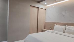 Postel nebo postele na pokoji v ubytování Shire Hotel Busan Station