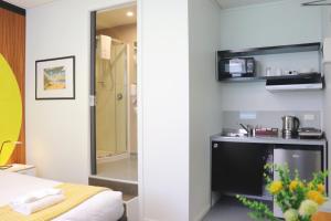 Postel nebo postele na pokoji v ubytování Wellington Hotel