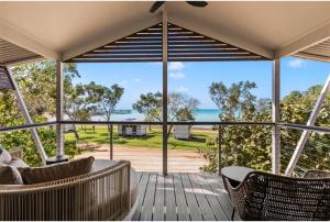 a view of the ocean from the porch of a house at Discovery Parks - Broome in Broome