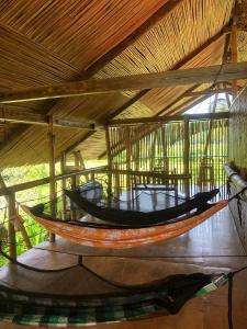 a large boat hanging from the ceiling of a building at Surf and Skate Duli El Nido By Kiteclub Palawan in El Nido