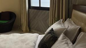 Postel nebo postele na pokoji v ubytování Hotel les Polygones Kribi