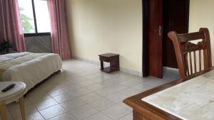 Postel nebo postele na pokoji v ubytování Hotel les Polygones Kribi