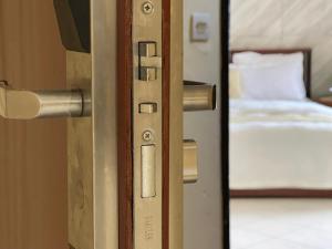 Postel nebo postele na pokoji v ubytování Hotel les Polygones Kribi