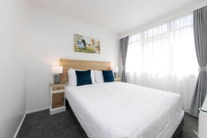 Postel nebo postele na pokoji v ubytování Aarangi Motel