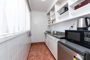 Kuchyň nebo kuchyňský kout v ubytování Aarangi Motel