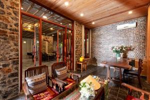 a living room with two chairs and a table at LittleTamCoc Boutique Villa Ninh Binh in Ninh Binh