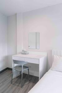 Postel nebo postele na pokoji v ubytování Ma Non Nont Hotel & Apartment
