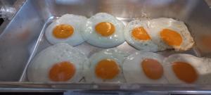 a bunch of eggs in a plastic container at Baan Pordeedin in Chiang Rai