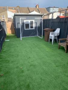 a backyard with a soccer goal and a bench at Gordon Road in Gillingham