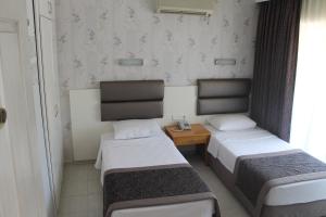 Кровать или кровати в номере Ida Hotel