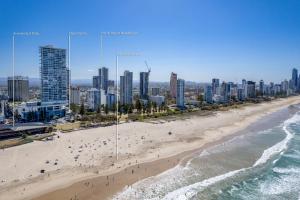 an aerial view of a beach in front of a city at Pacific Resort Broadbeach in Gold Coast