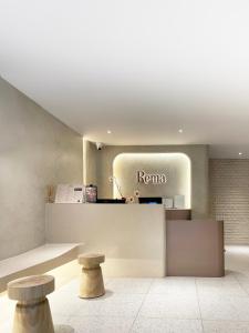 a store with a roma counter and two stools at Rema residence China town Main Road in Bangkok