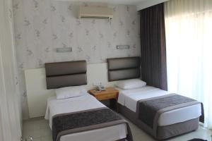 Кровать или кровати в номере Ida Hotel