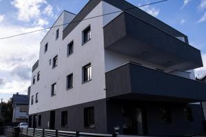 a black and white building with at Hugo apartments in Zagreb