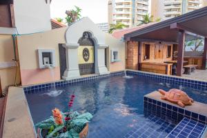 a swimming pool with a turtle in the water at Thabali Oasis:3BHK private pool villa + Sauna in Pattaya South