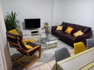 TV a/nebo společenská místnost v ubytování Appartement 6-8 personnes - Calme - Neuf - 15 min de Paris + 6 fotografií