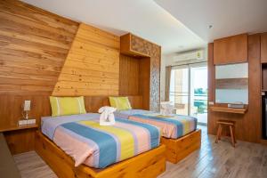 Postel nebo postele na pokoji v ubytování Tamnanpar Resort