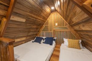Postel nebo postele na pokoji v ubytování Camanolo Homestay