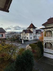 a view of a town with houses and a street at Historische Villa im Herzen Rankweils in Rankweil