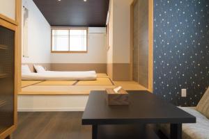 Una cama o camas en una habitación de Guesthouse ZenNichi