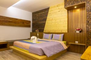 Postel nebo postele na pokoji v ubytování Tamnanpar Resort