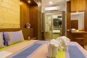 Postel nebo postele na pokoji v ubytování Tamnanpar Resort