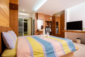 Postel nebo postele na pokoji v ubytování Tamnanpar Resort