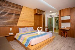 Postel nebo postele na pokoji v ubytování Tamnanpar Resort