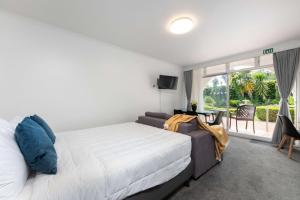 Postel nebo postele na pokoji v ubytování Aarangi Motel